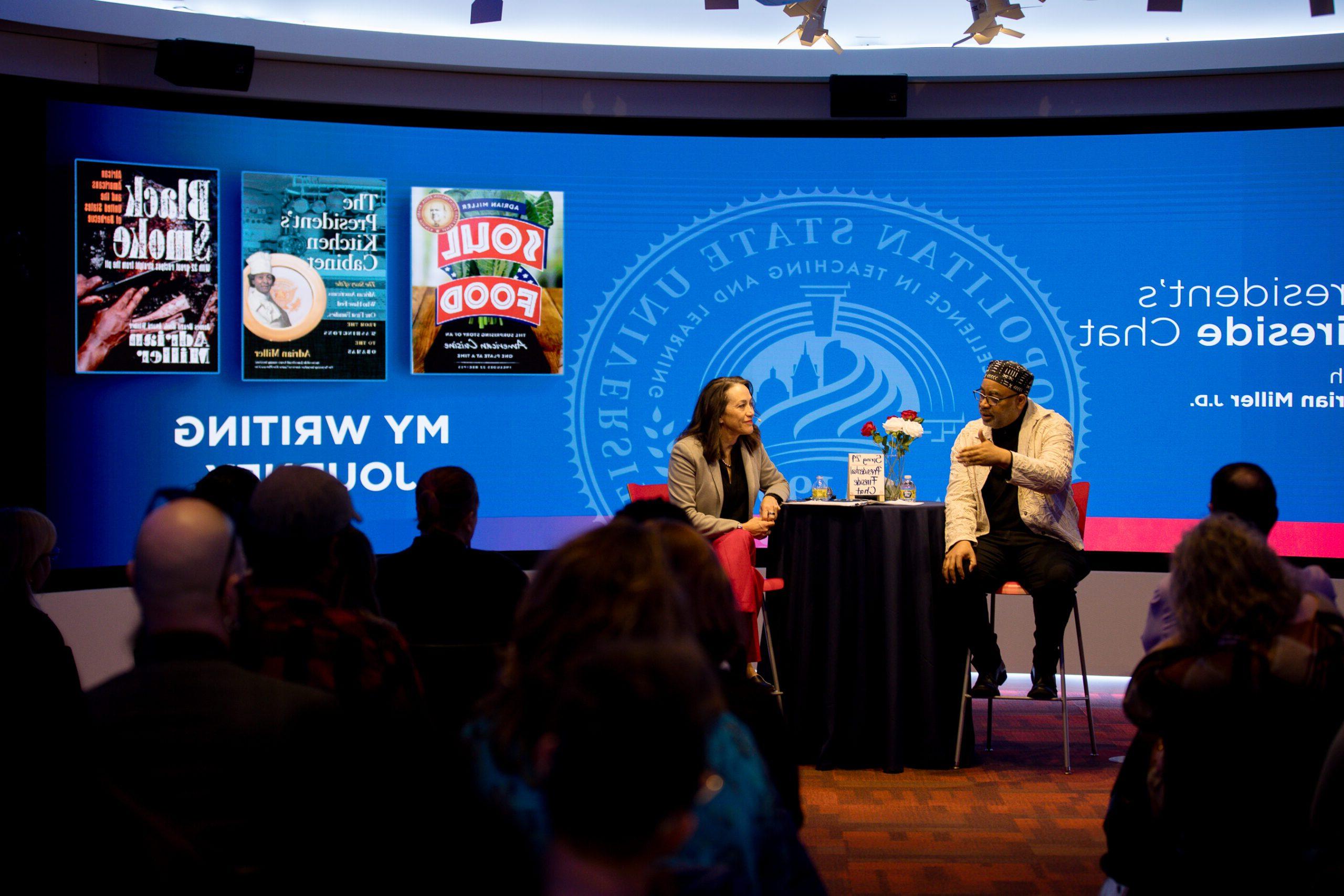 A Fireside Chat discussion, a signature held in the CAVEA each semester. President Davidson chats with guest, Adrian Miller.